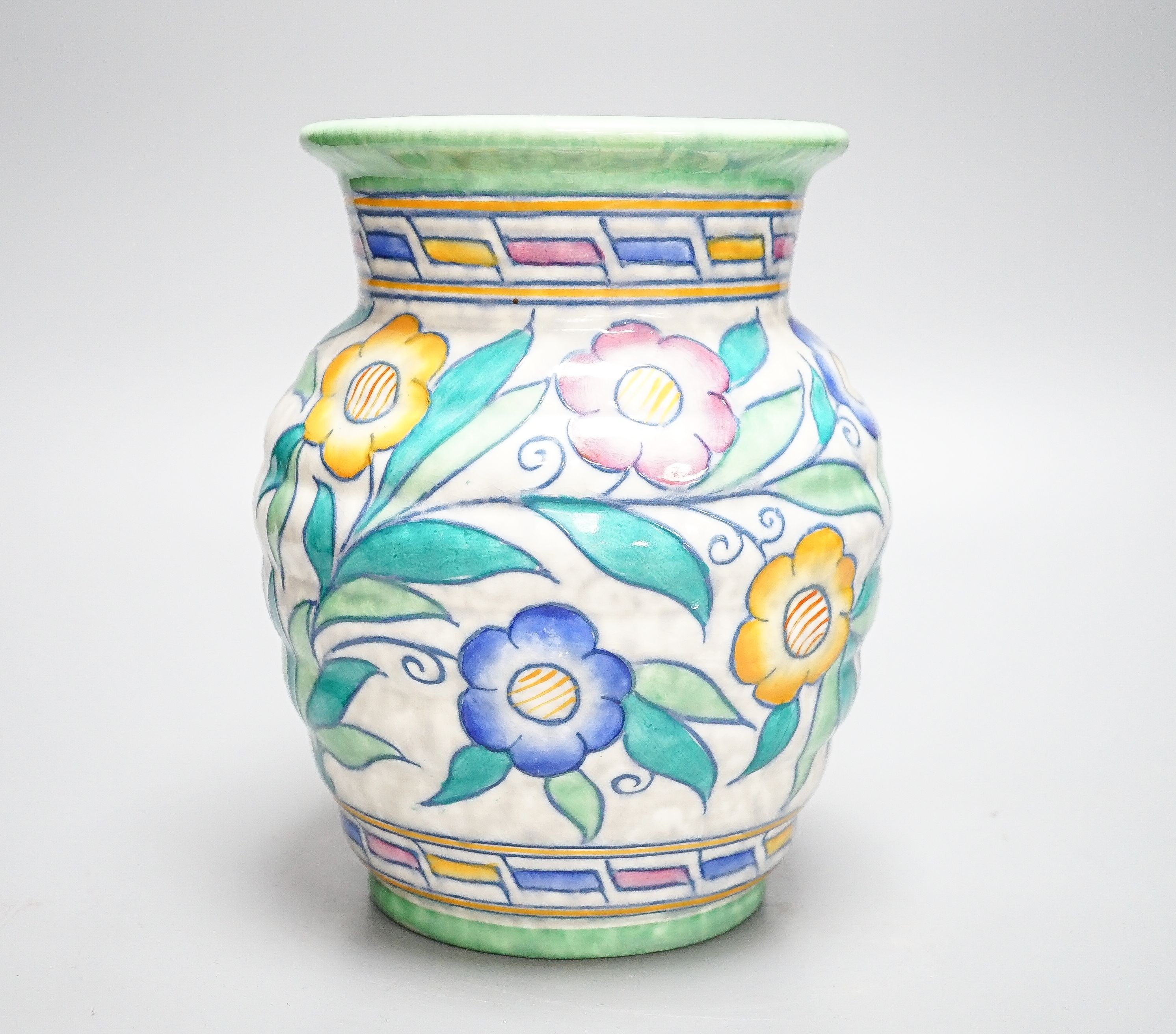 A Charlotte Rhead vase, painted with flowers in polychrome enamels, 20cm